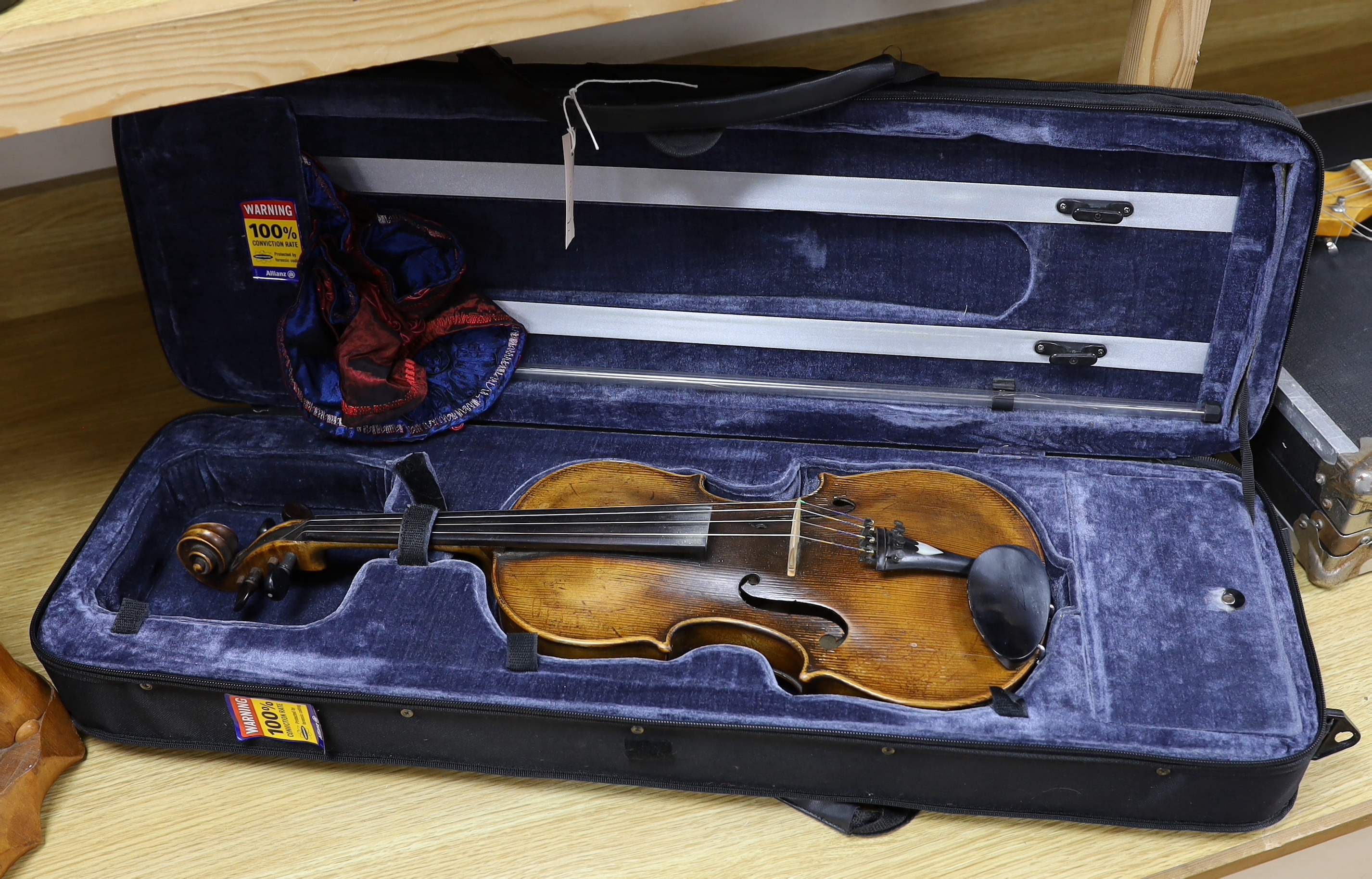 An early 20th century English violin stamped Norman Duke, London, one piece back with wax seal, cased, violin 60cm long